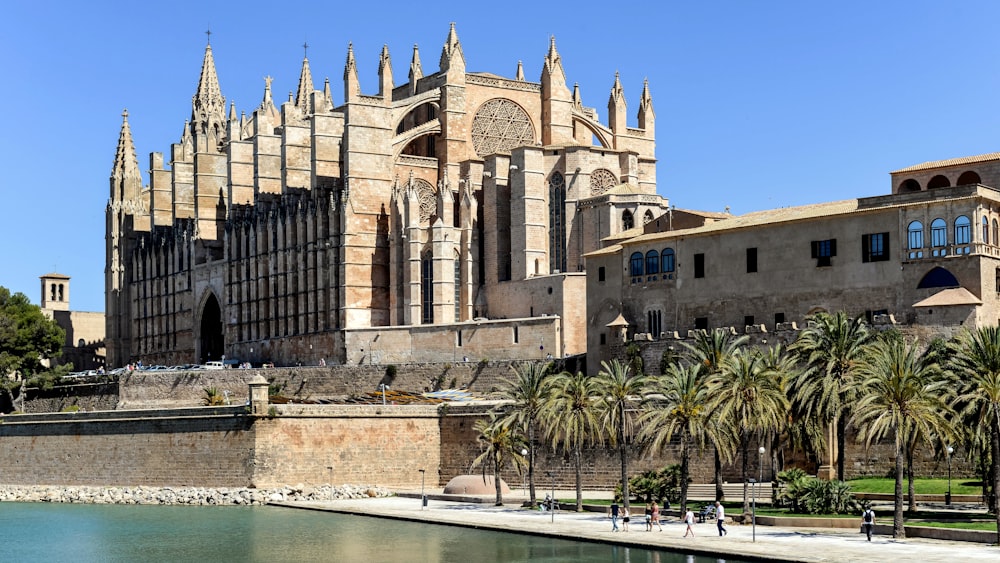 a large building sitting next to a body of water