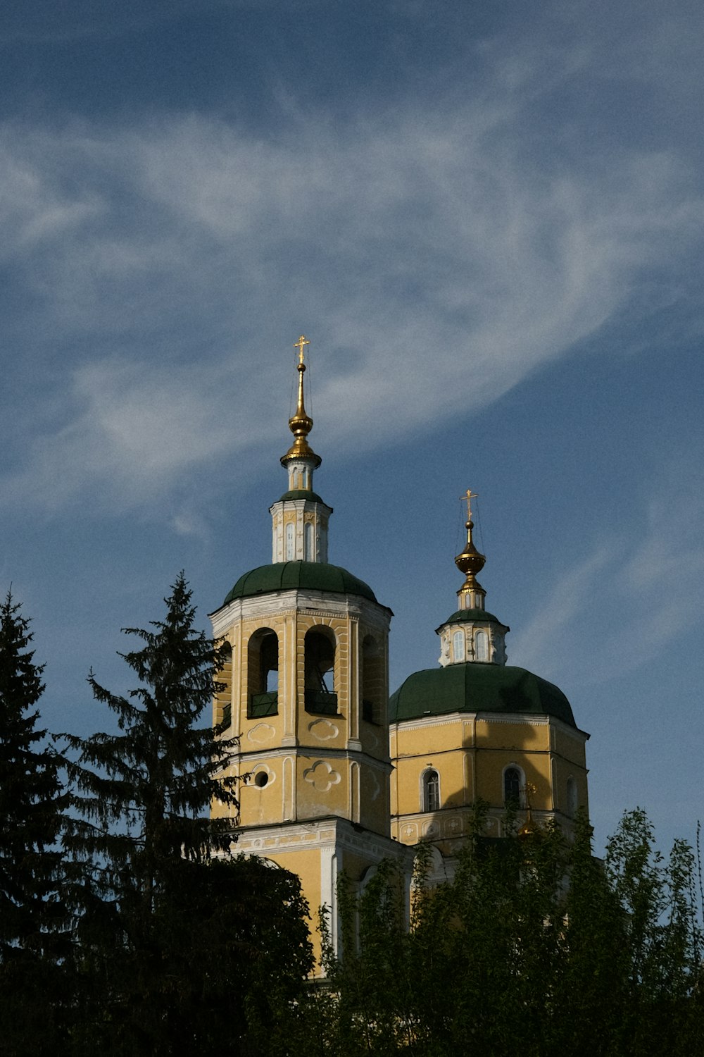 a building with two towers and a clock on it