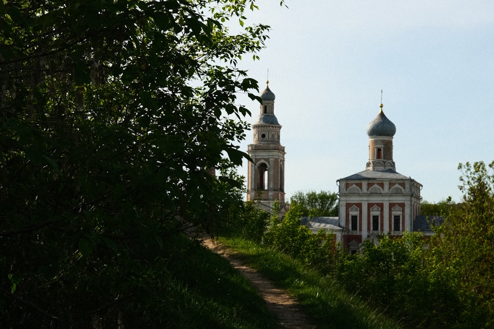 a church with two towers and a steeple in the background