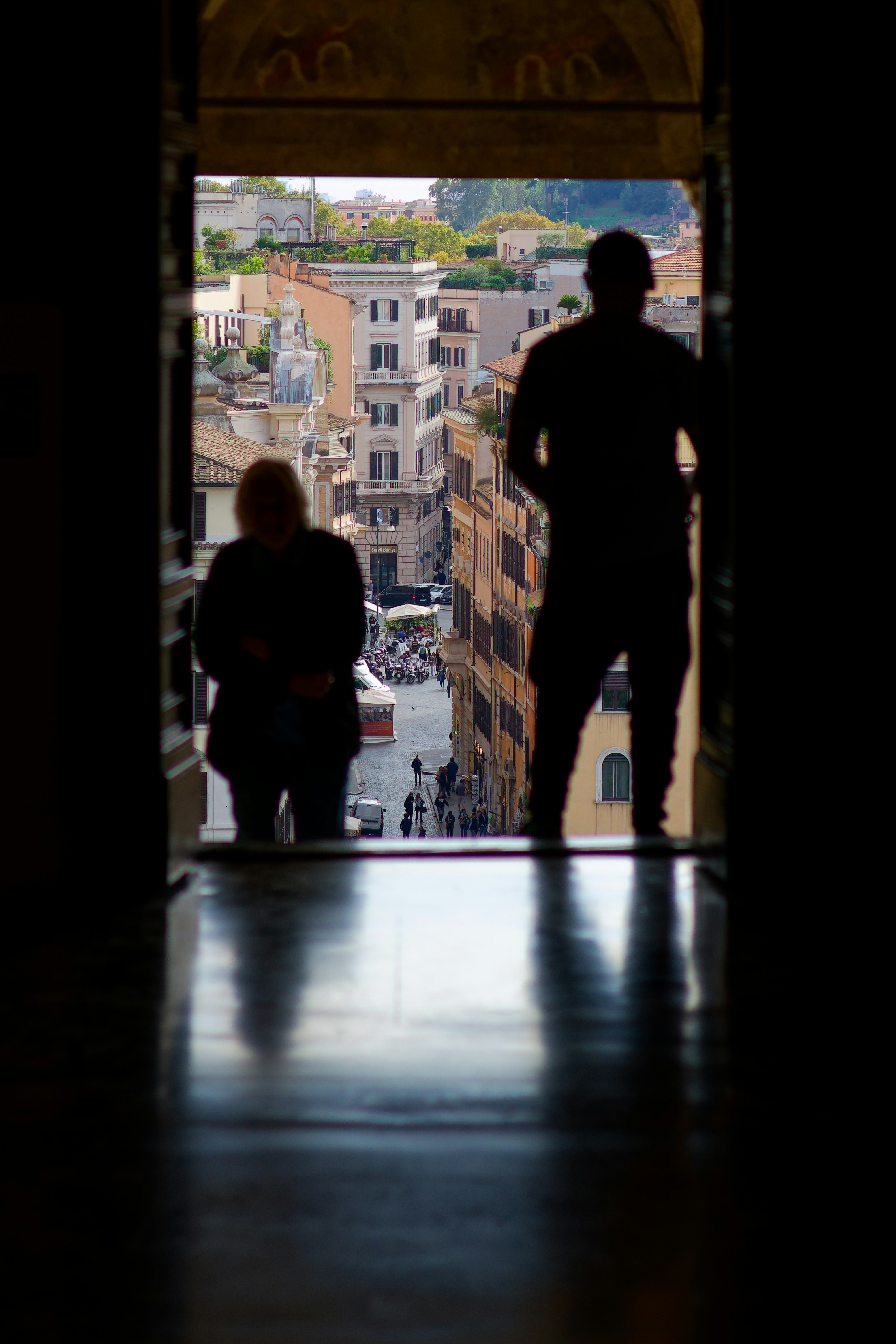 a couple of people that are standing in a doorway