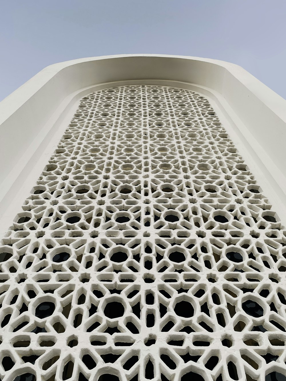 a close up of a building with a sky background