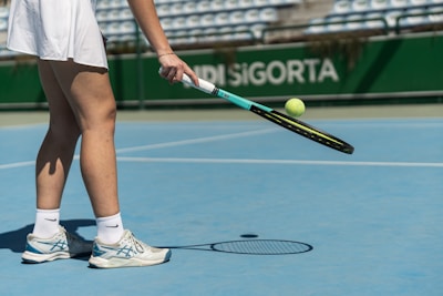 a tennis player prepares to hit a tennis ball
