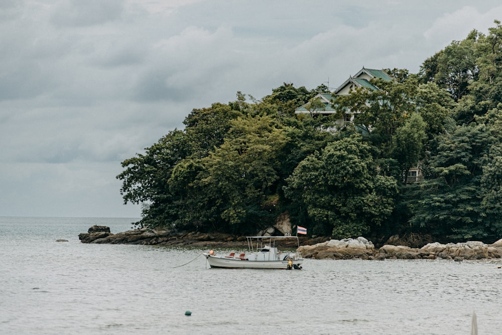 a boat floating on top of a body of water