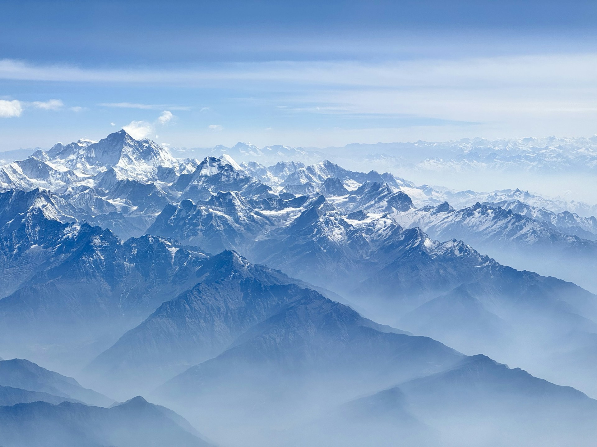 a view of a mountain range from an airplane