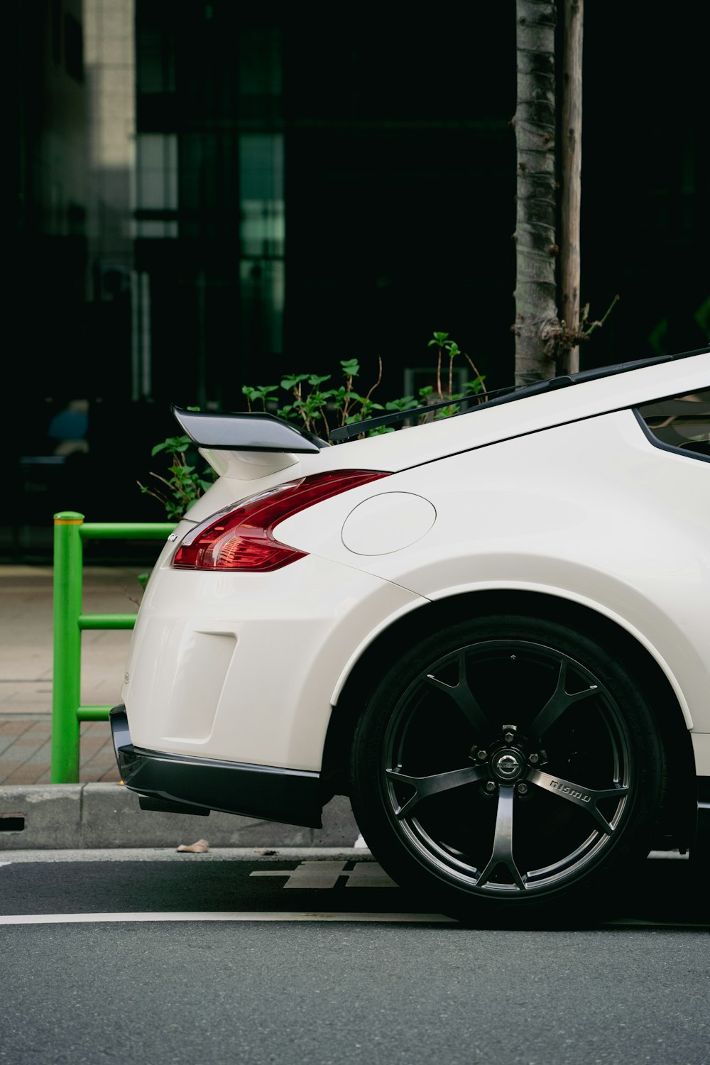 a white car parked on the side of the road