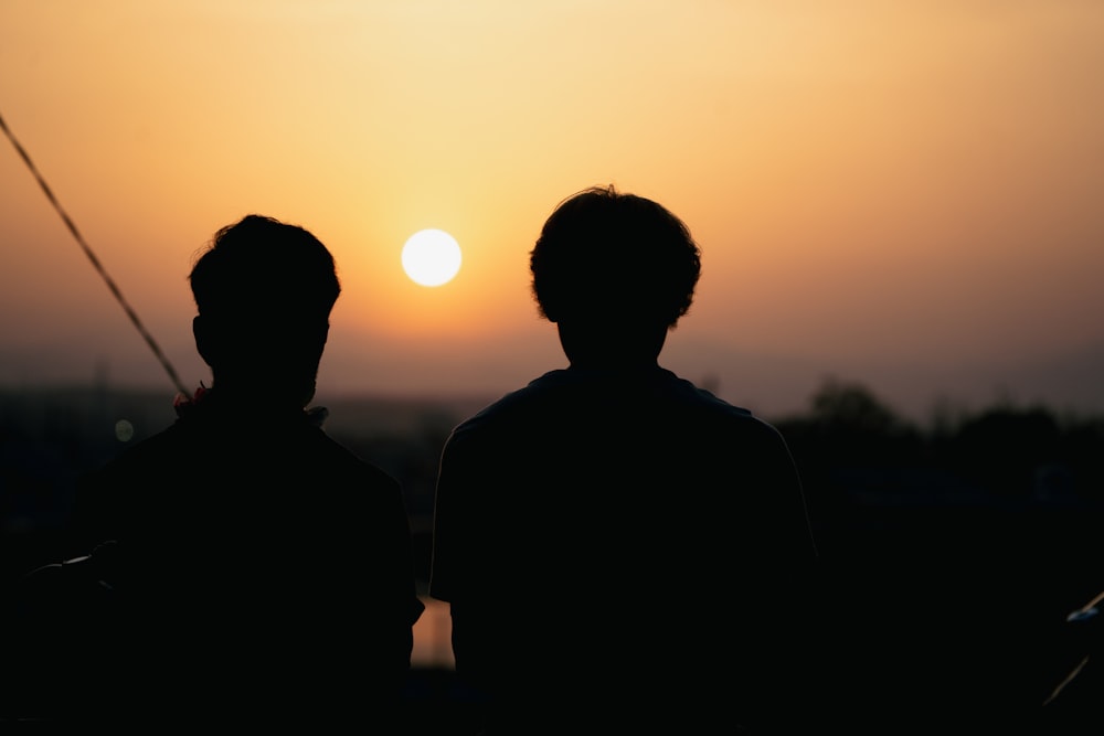 a couple of men standing next to each other