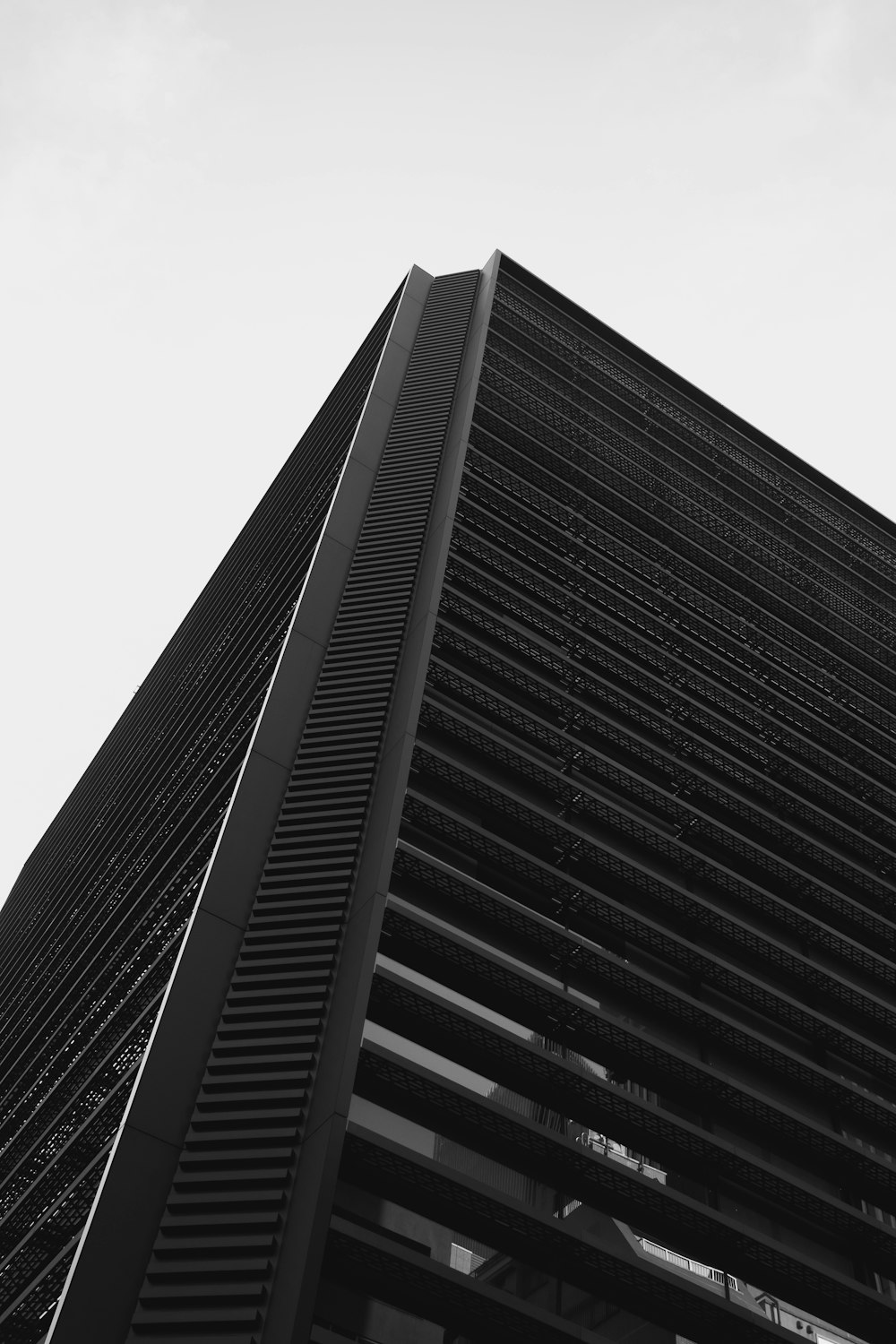 a black and white photo of a tall building