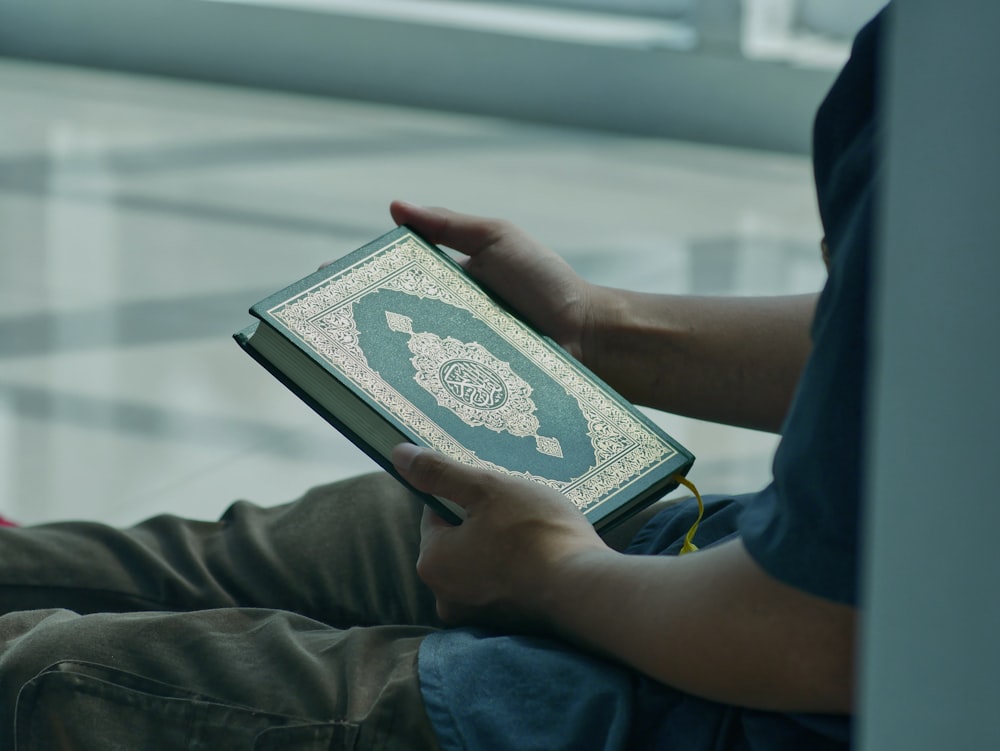 a person holding a book in their hands