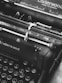 a black and white photo of an old fashioned typewriter