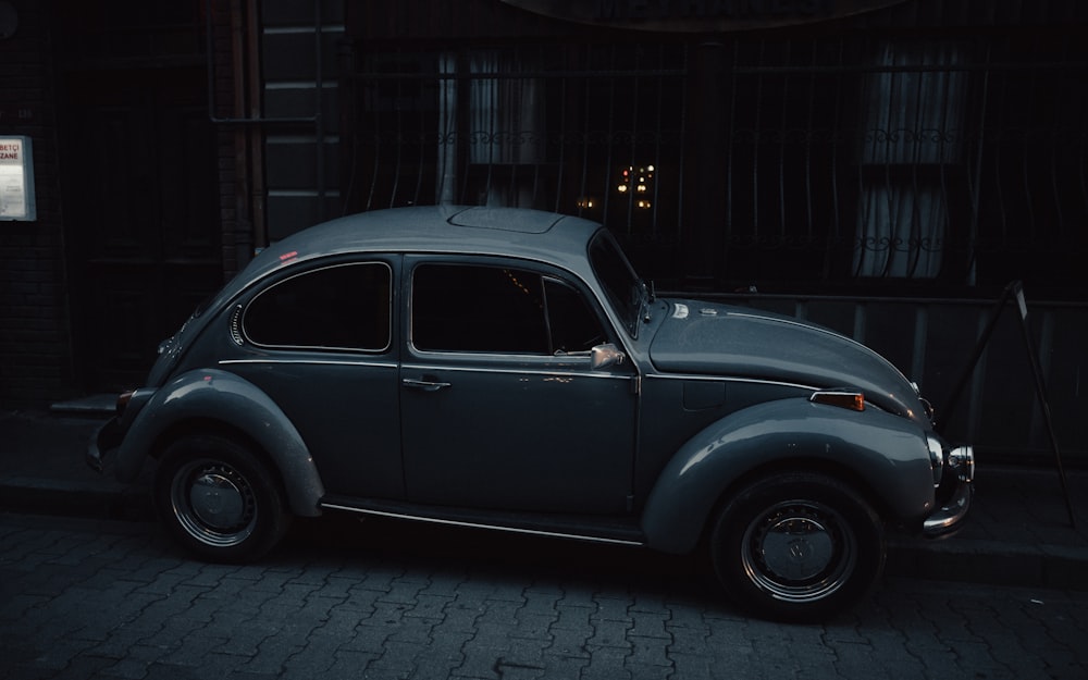 an old car parked on the side of the road