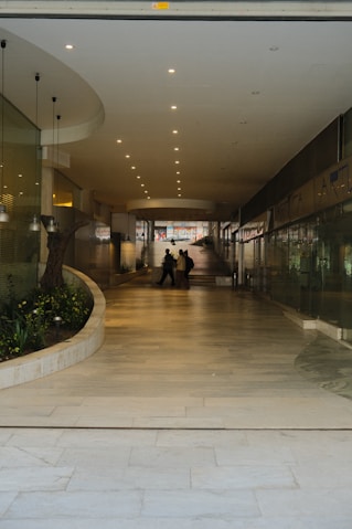 a couple of people that are standing in a building