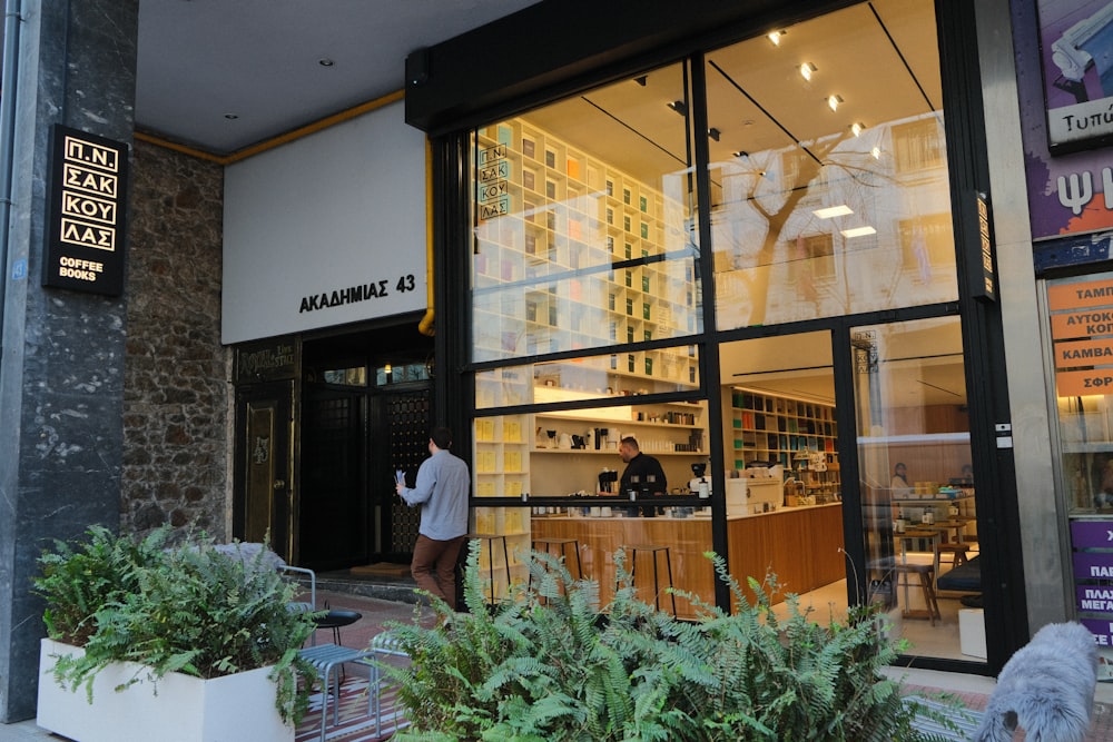 a man is standing outside of a store