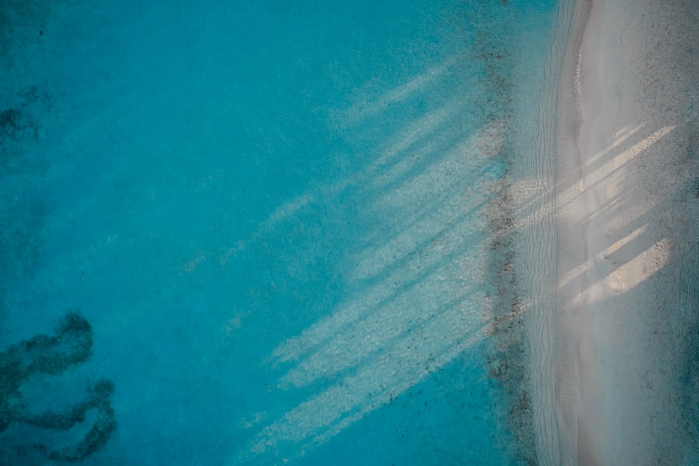 a bird's eye view of a beach and a body of water