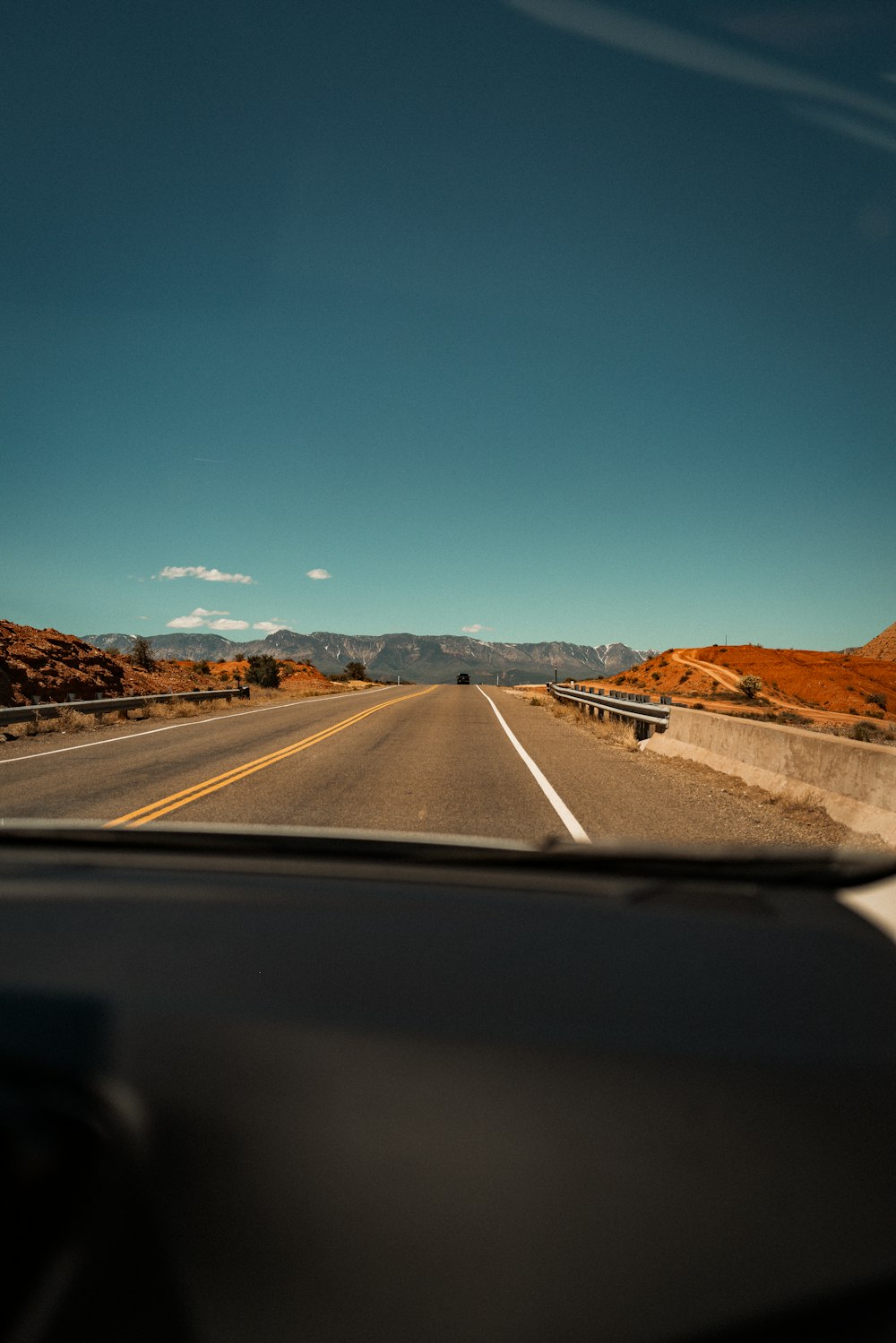 a view of a highway from inside a car