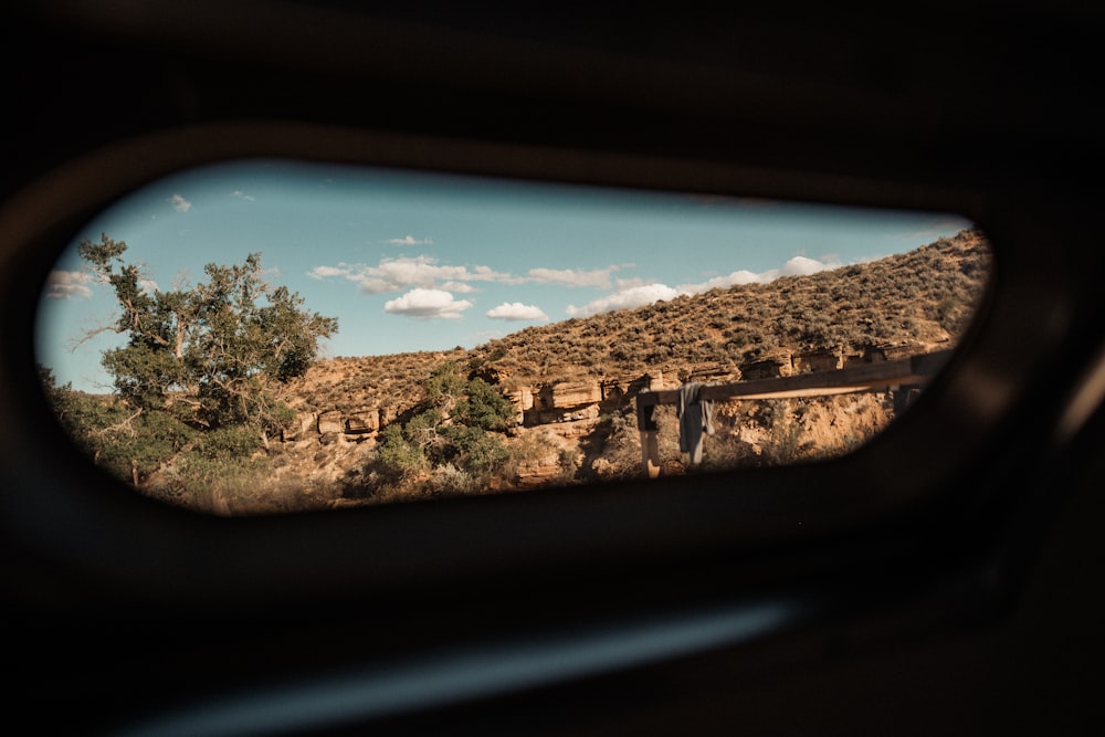 a view of a mountain from a vehicle window