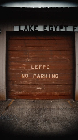 a garage door that has graffiti on it