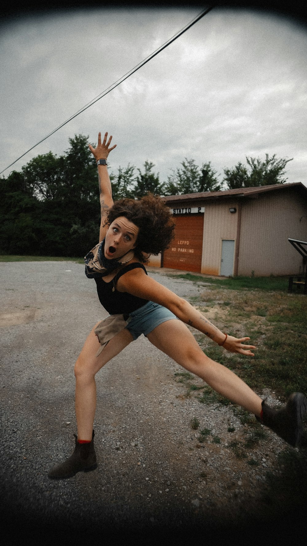 a woman jumping in the air while holding a frisbee