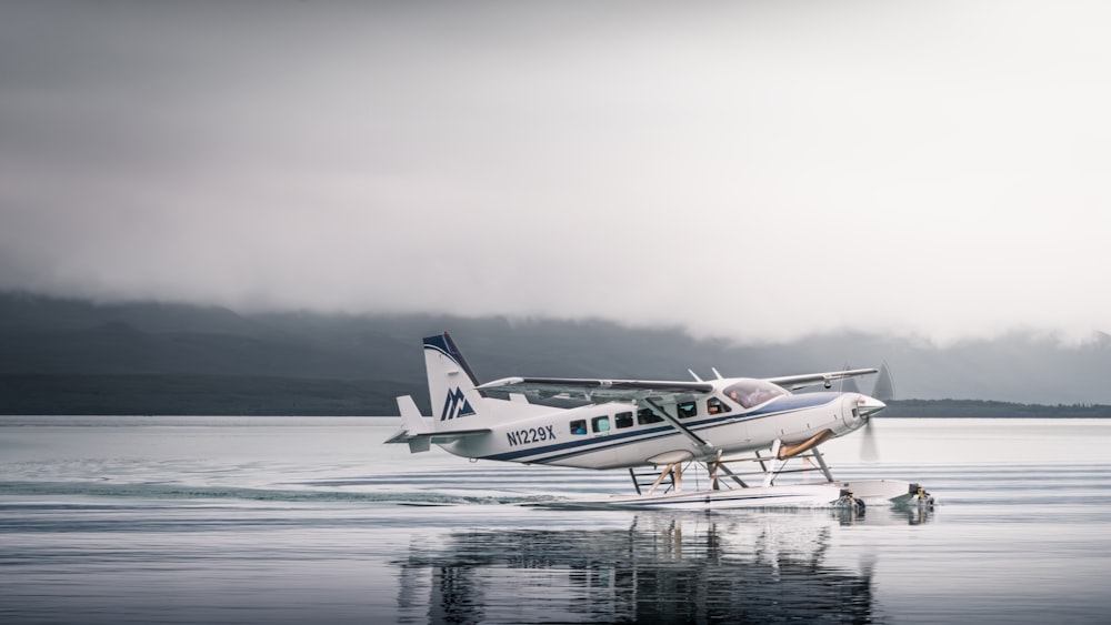 a small plane sitting on top of a body of water