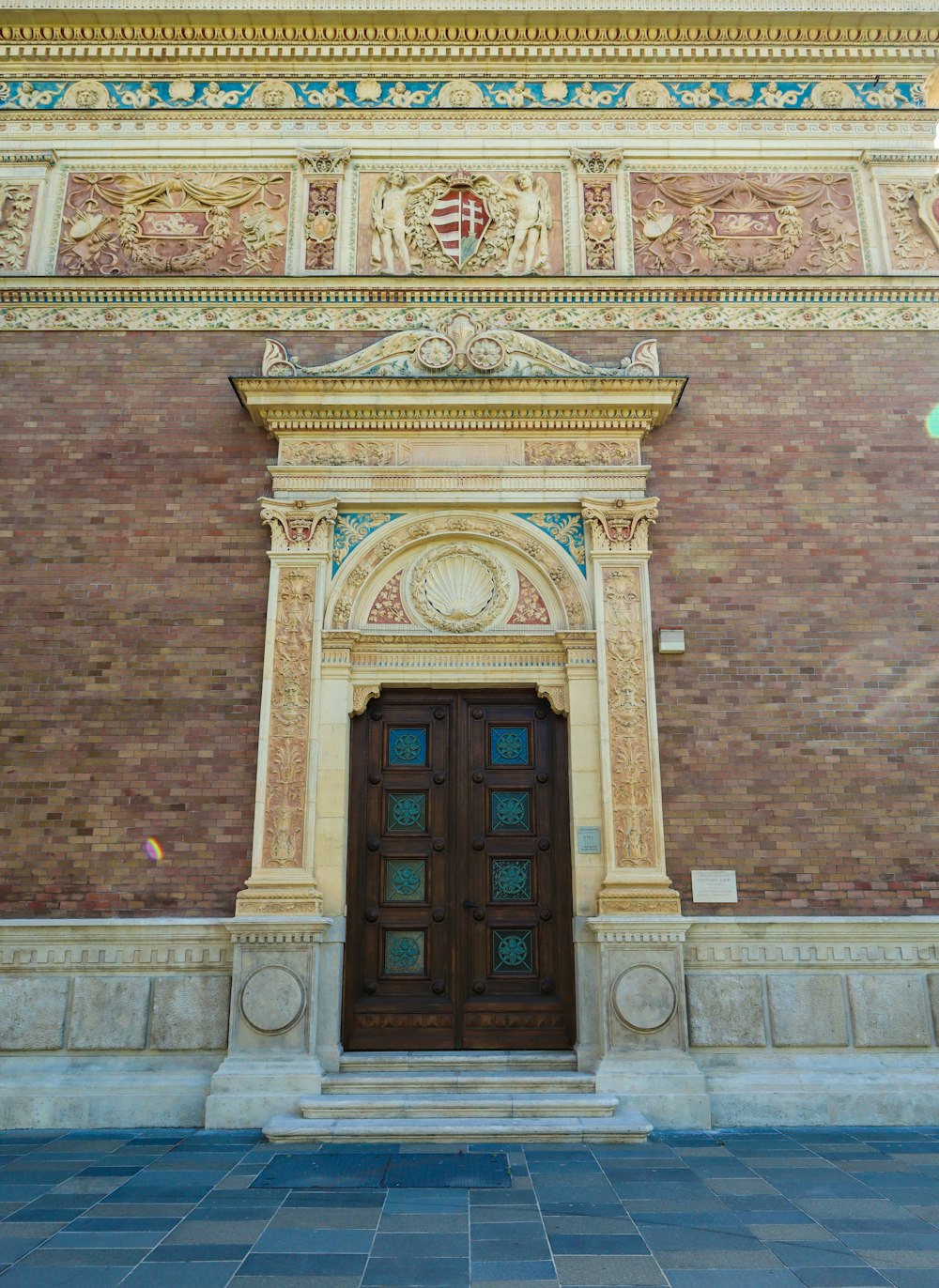 a building with a large wooden door in front of it