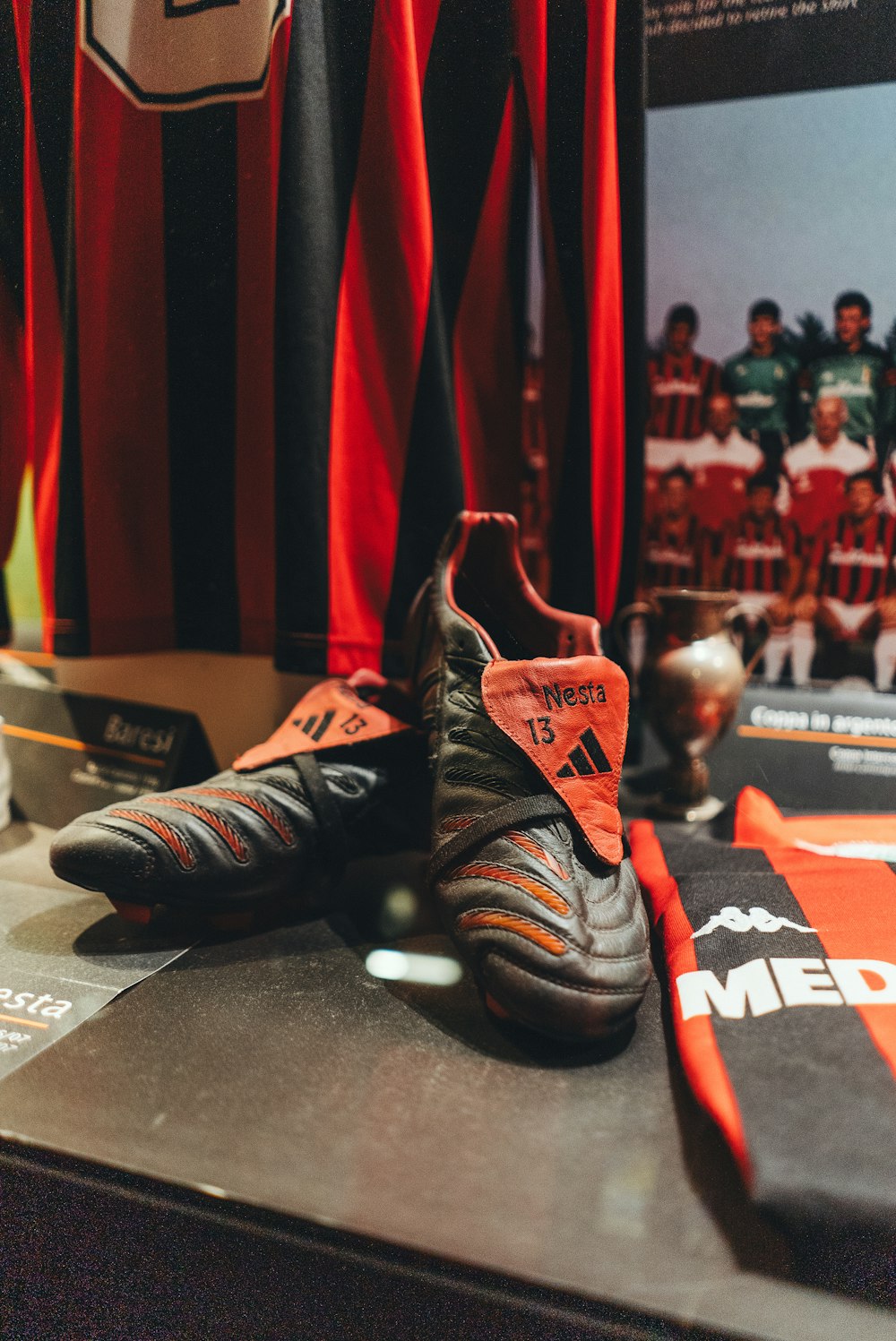 a pair of soccer cleats sitting on top of a table