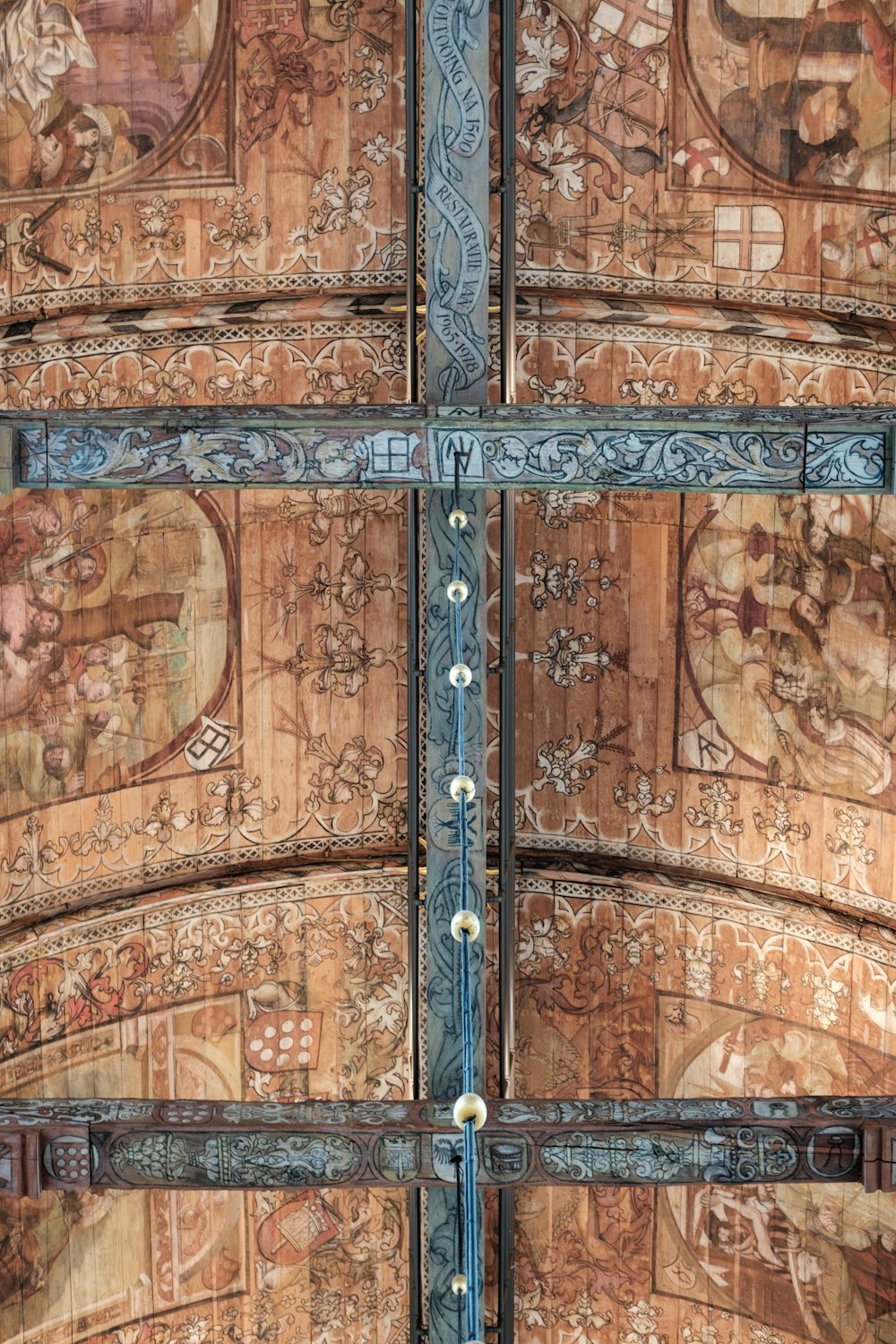a close up of a wooden door with a painting on it