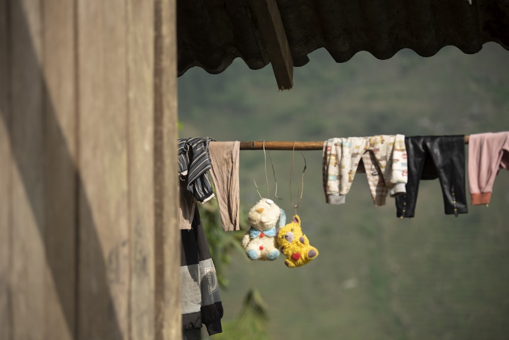 a clothes line with stuffed animals hanging from it