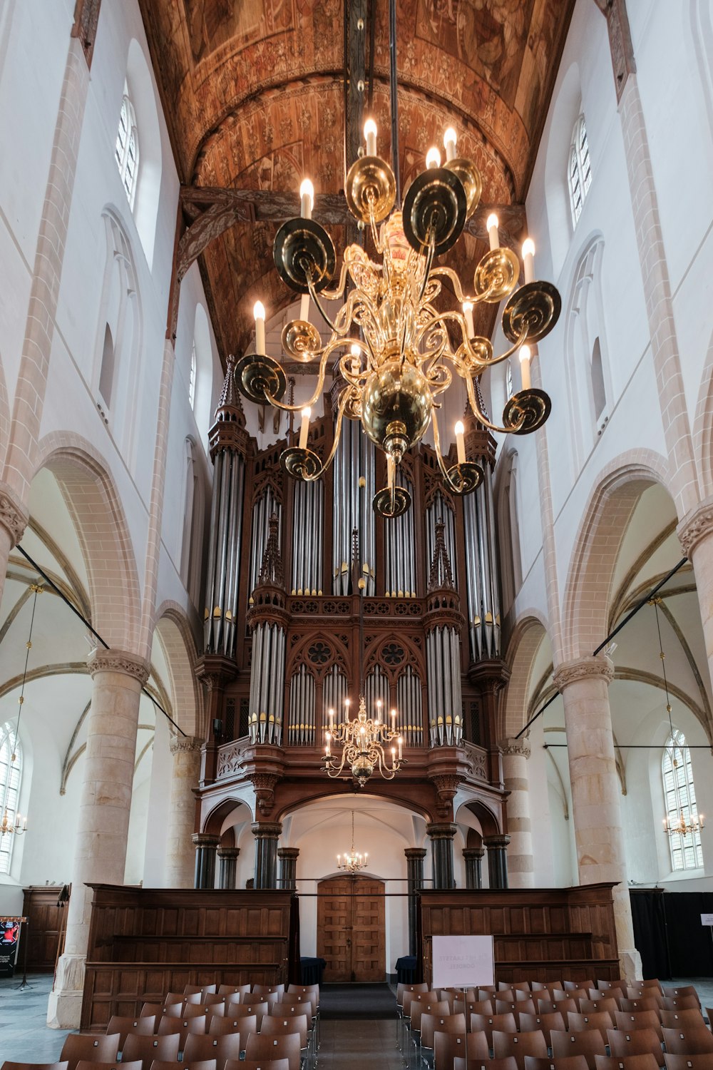 a chandelier hanging from the ceiling of a church