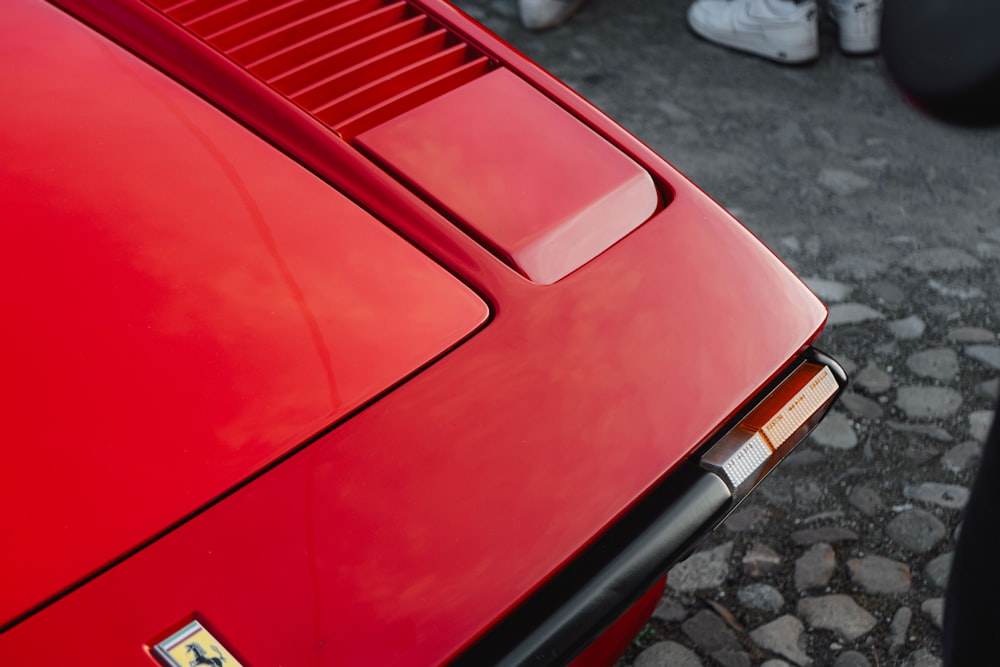 a close up of a red sports car