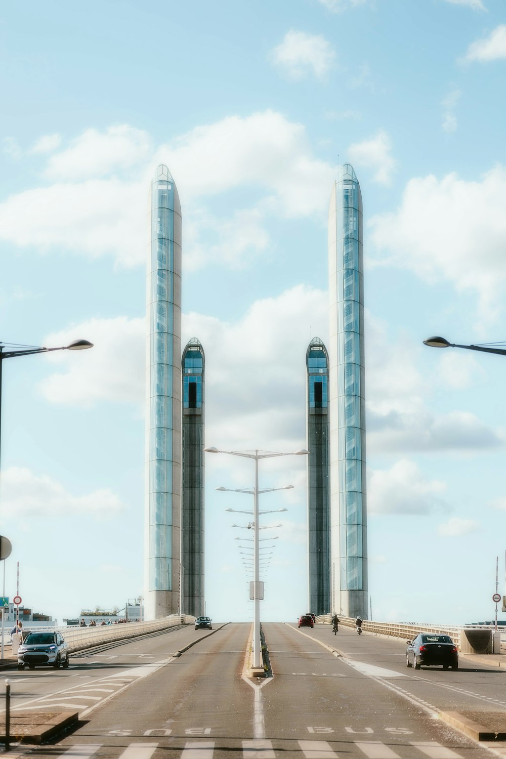 a couple of tall buildings sitting on the side of a road