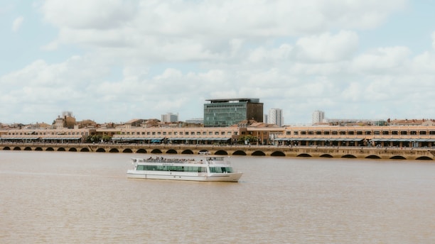 a large white boat floating on top of a river