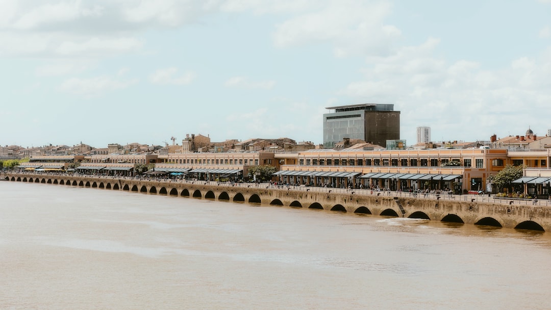 a train traveling over a bridge next to a river,