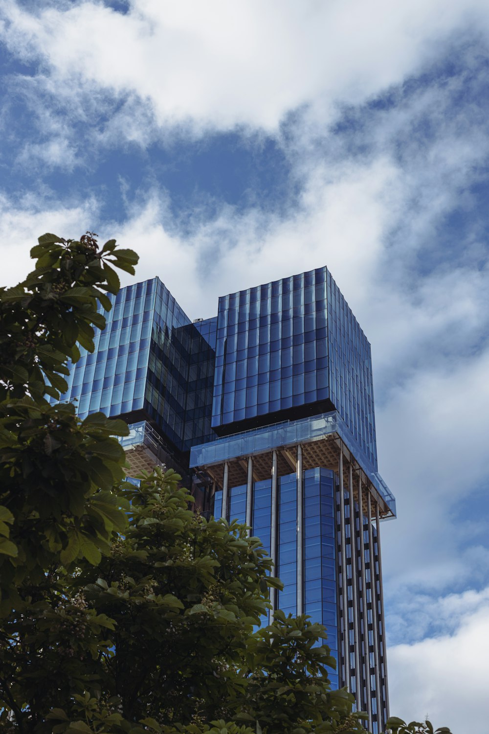 a very tall building with a sky background