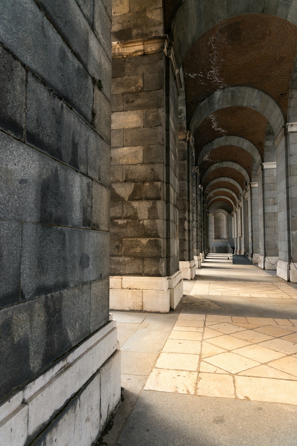 a long hallway with a clock on the wall