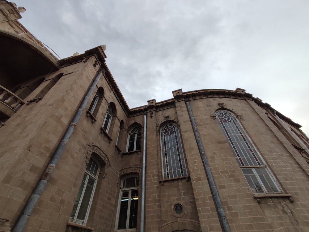 a tall building with a clock on the front of it