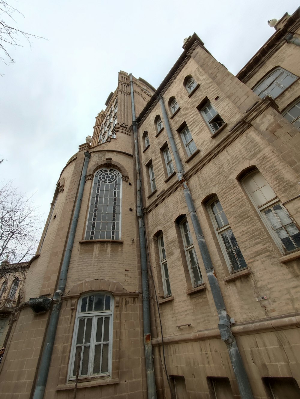 a tall building with a clock on the side of it