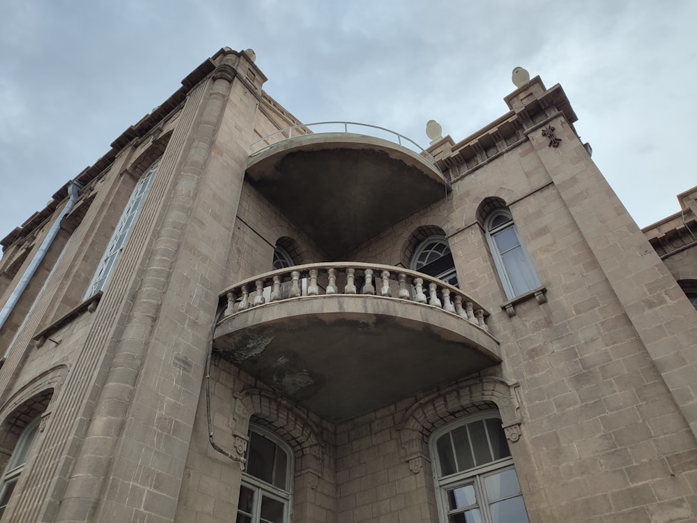 a tall building with a balcony and balconies