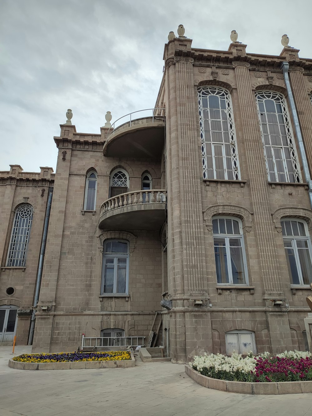 a large building with many windows and a balcony