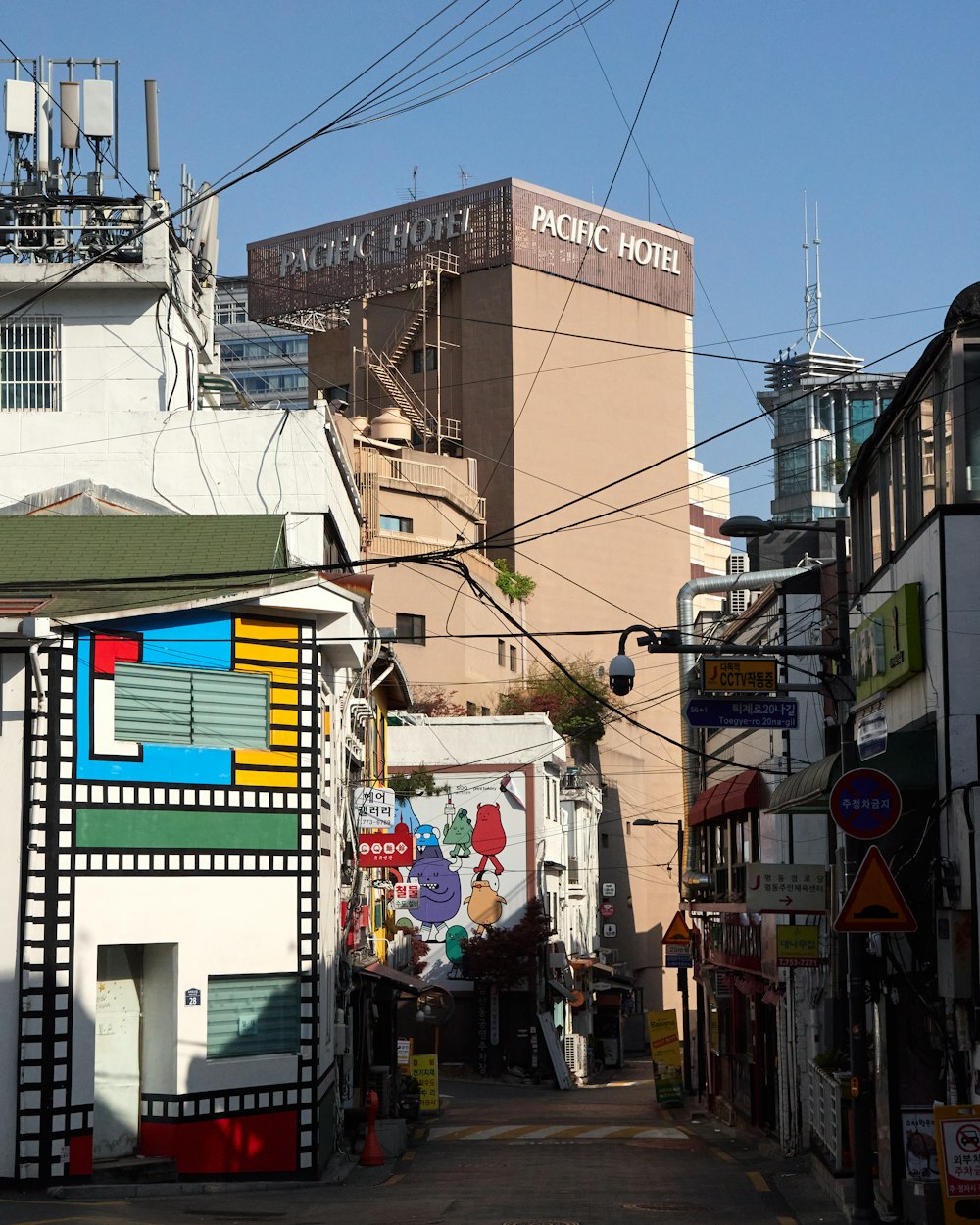 a city street lined with buildings and power lines