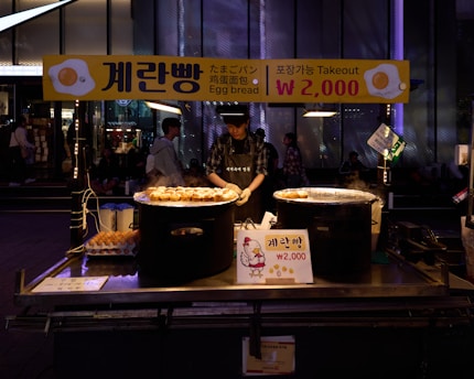 a man standing in front of a table filled with food