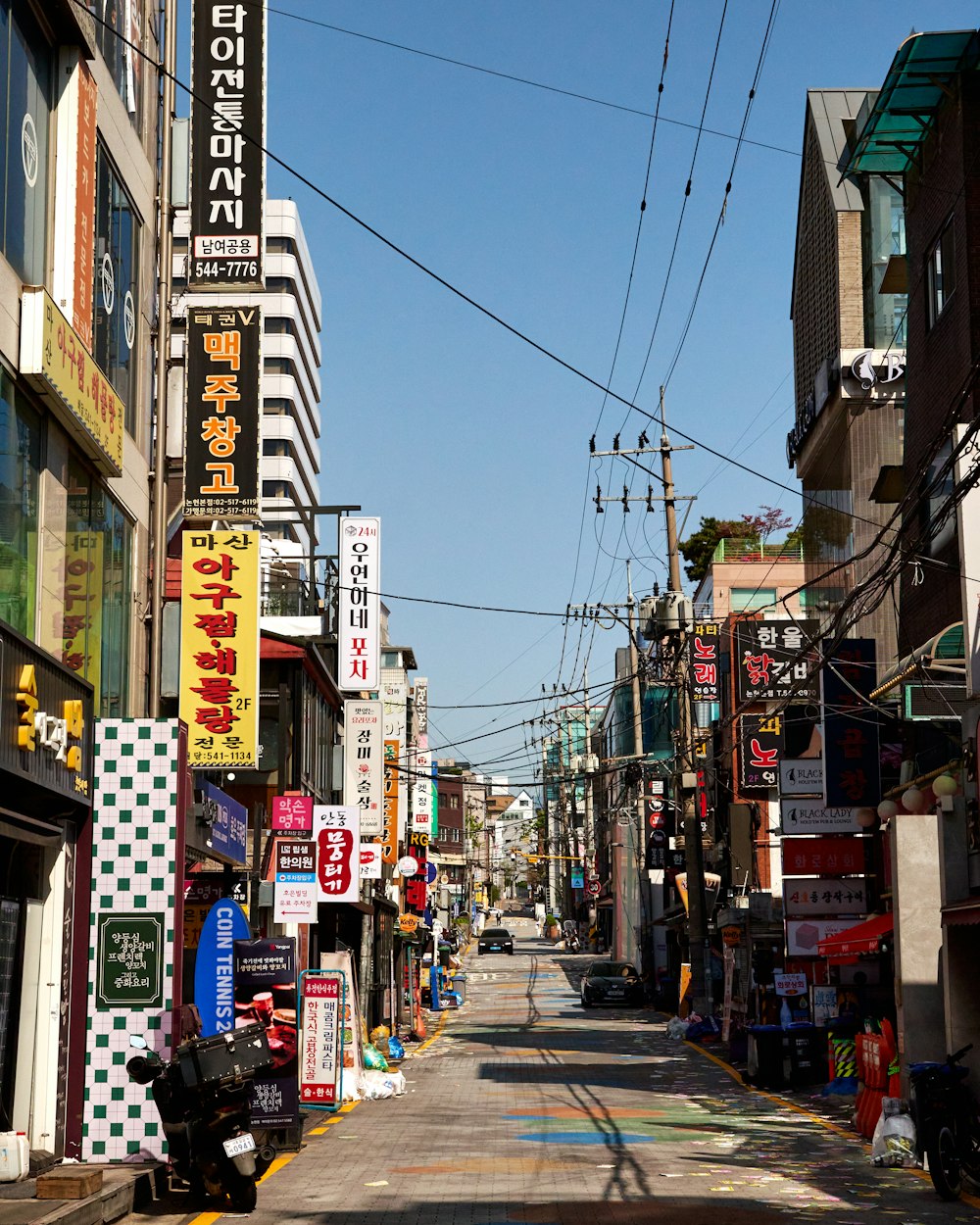 a city street lined with lots of tall buildings