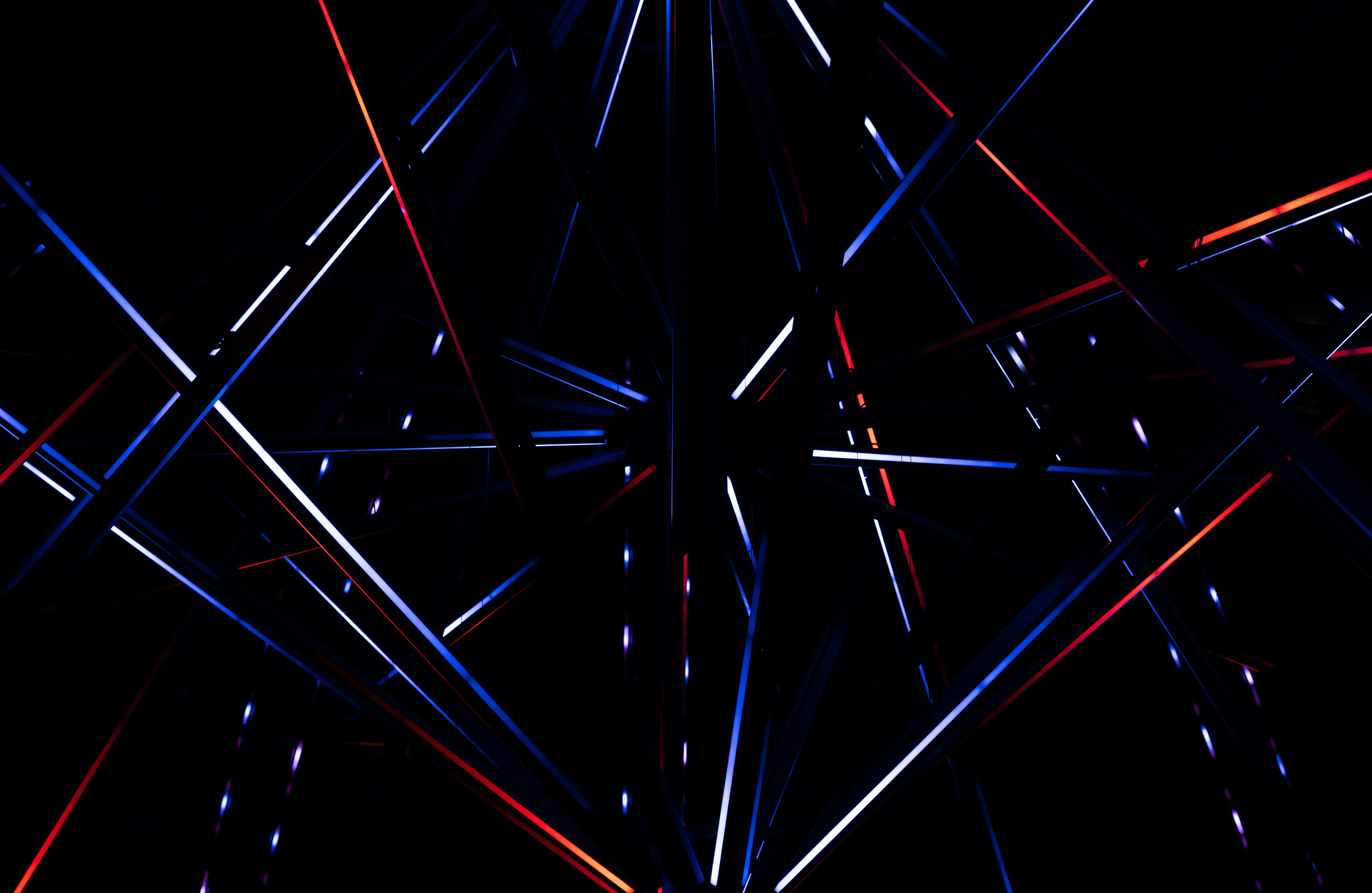 a black background with red, white and blue lines