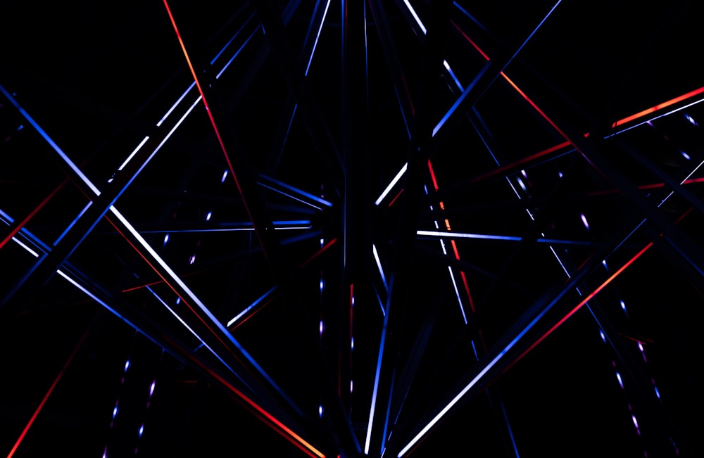 a black background with red, white and blue lines