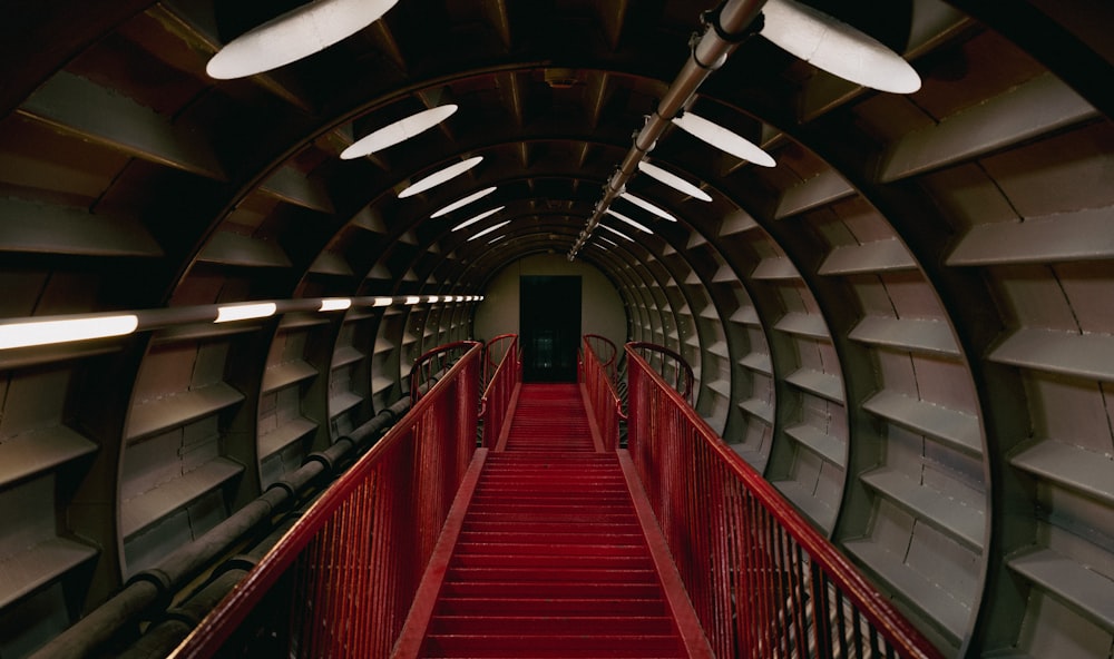 a red staircase leading to the top of a building