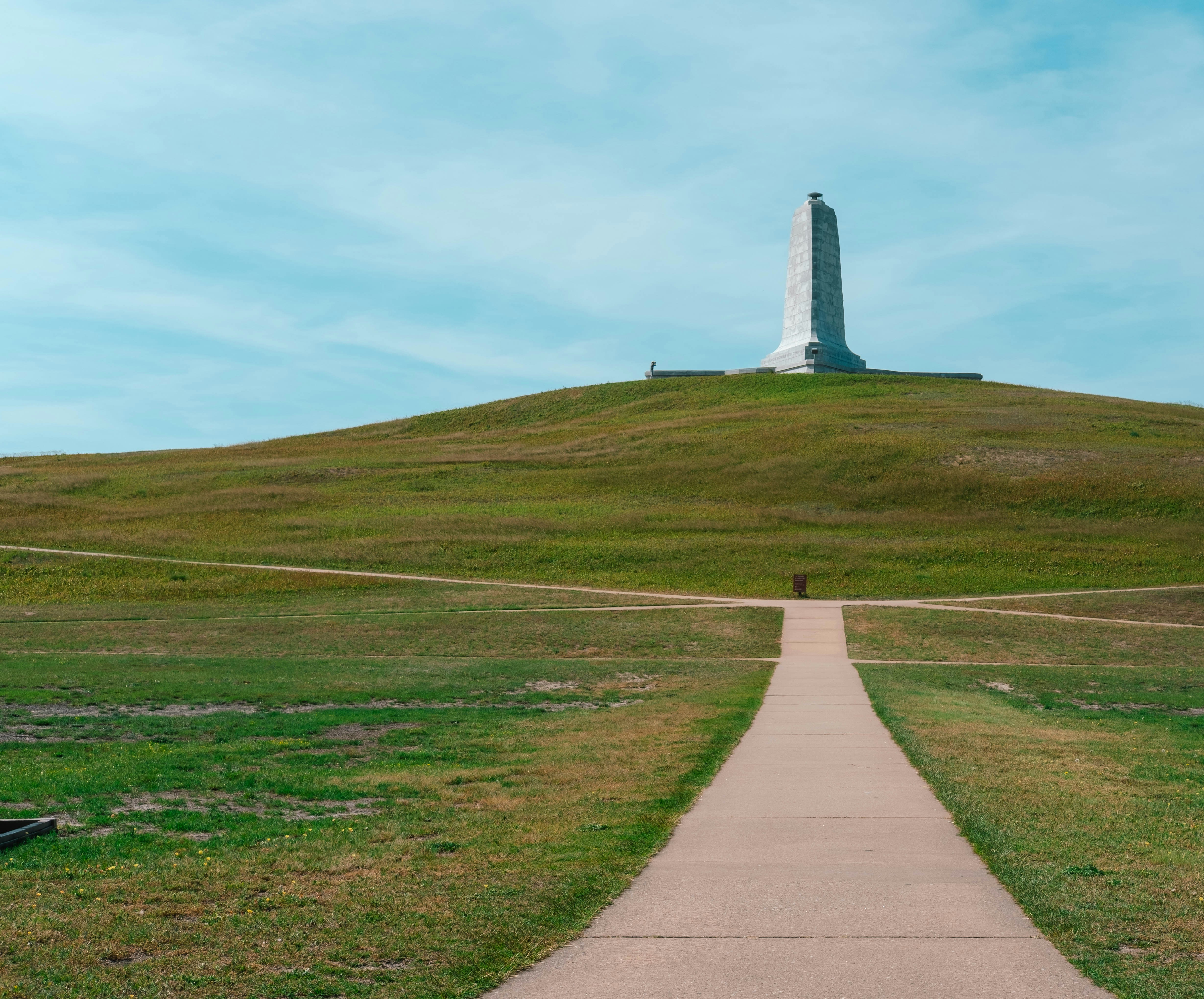 a path leading to a monument on top of a hill