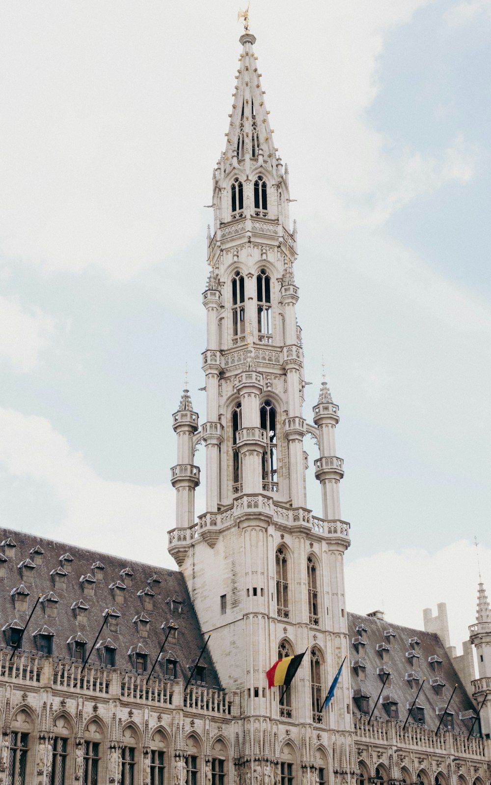 a very tall building with a clock on it's side