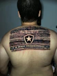 a man with a tattoo on his back