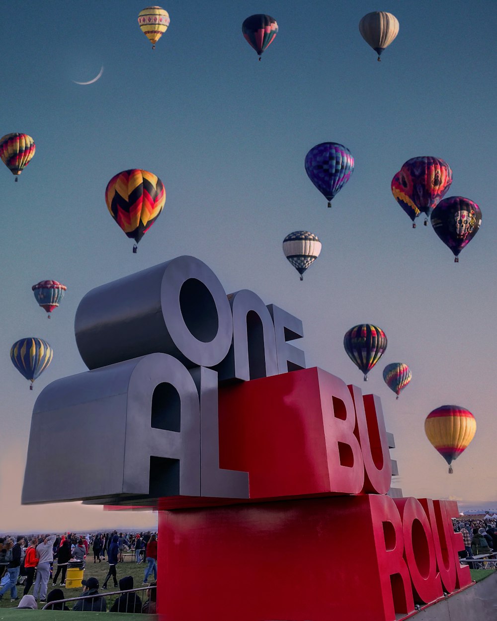 a group of hot air balloons flying over a sign