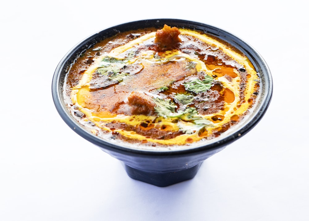 a bowl of food on a white table