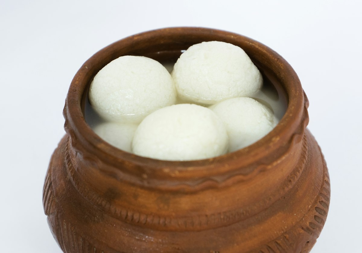 Fresh rasgulla Bengali sweets in sugar syrup served in a bowl