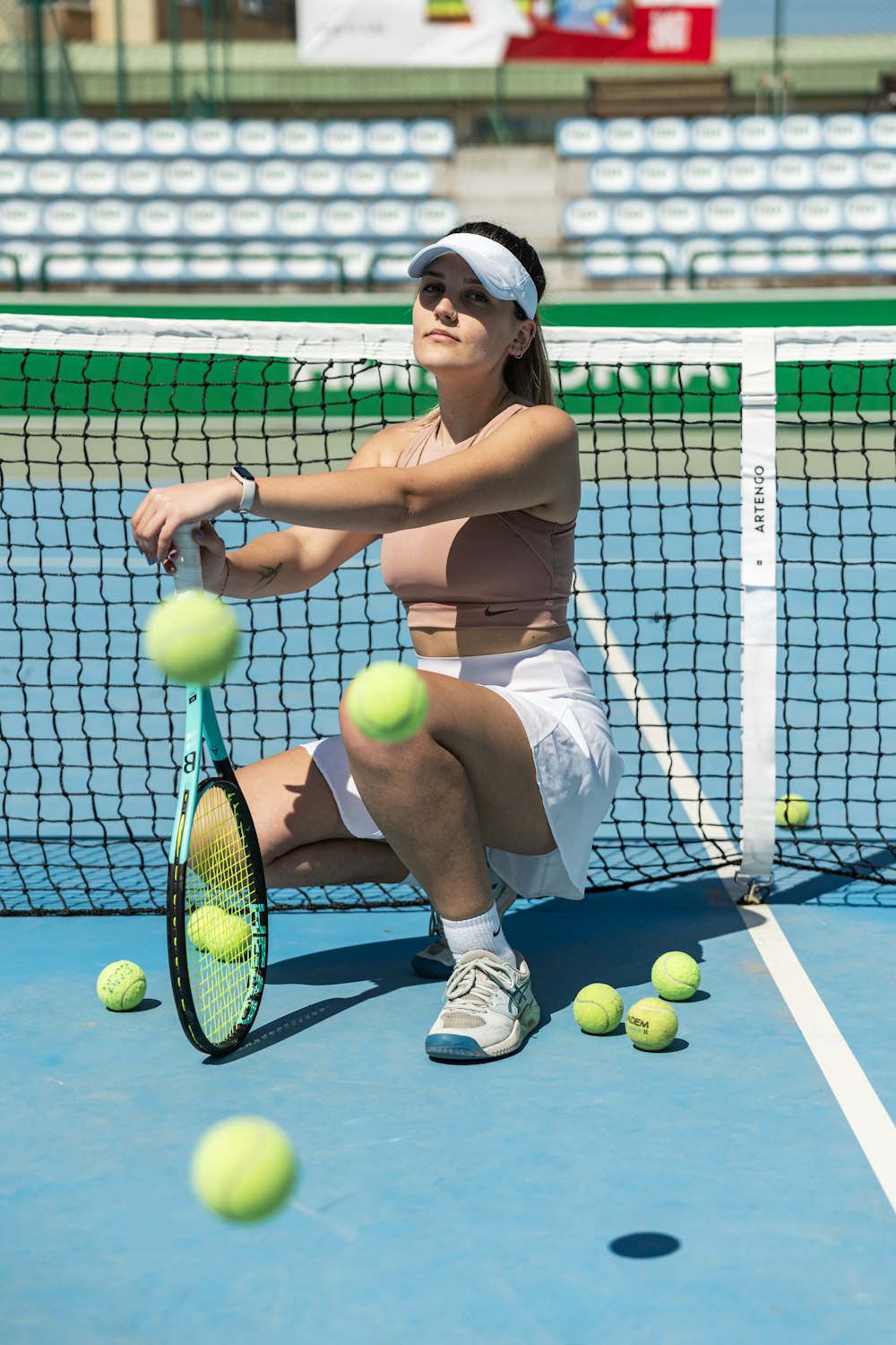 a woman is playing tennis on a tennis court